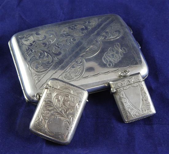 A George V silver cigarette case and two silver vesta cases, gross 6 oz.
